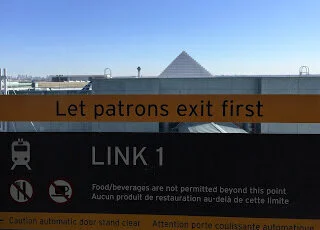 Union Pearson UP express train passes pyramid on its route