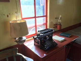 Underwood typewriter and bracket lamps on the train