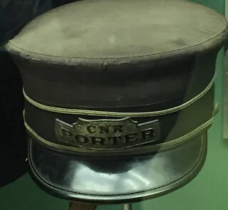 The CNR Porter's cap recalls the shame of a racist past
