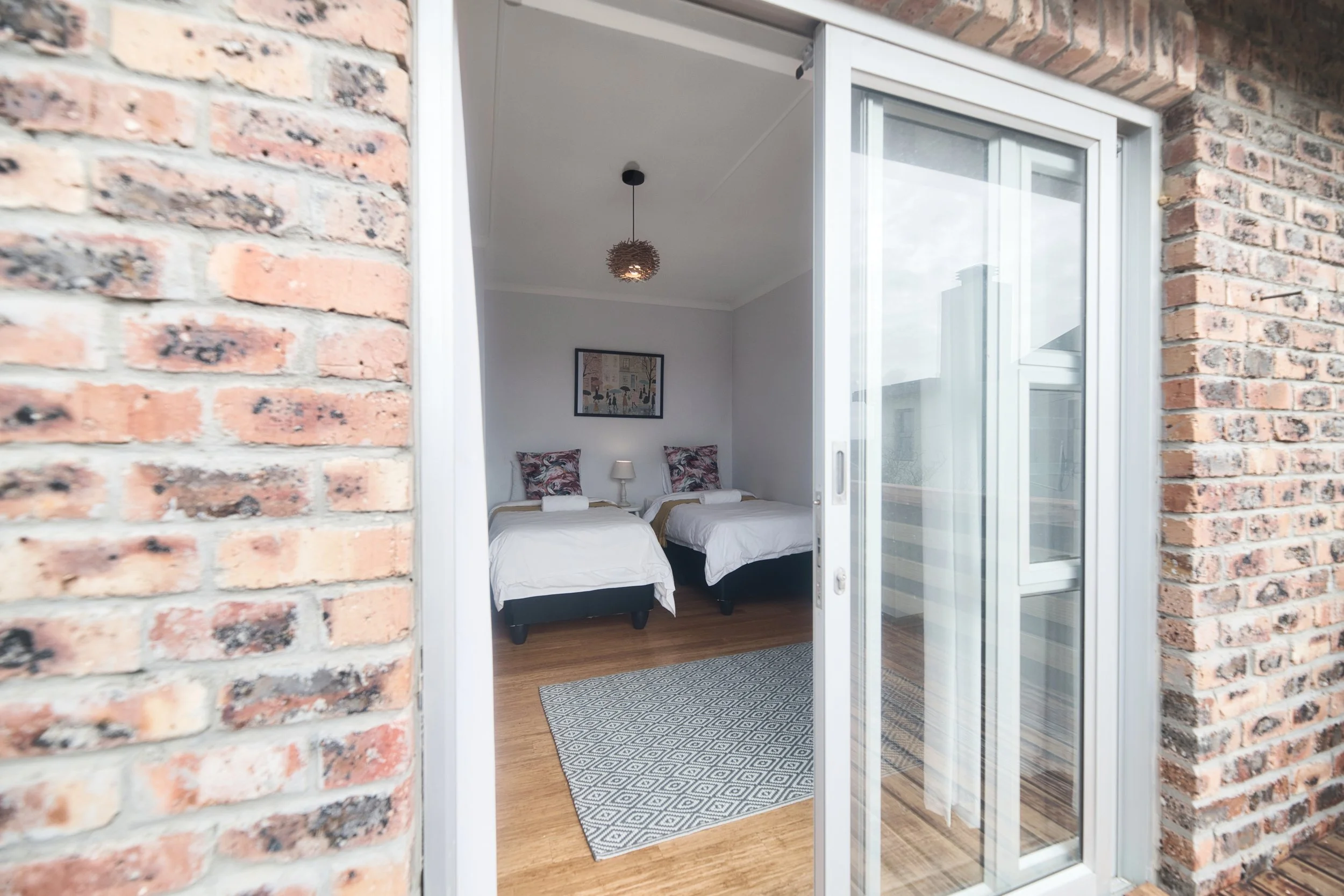 22-suikerbos-house-struisbaai-twin-bedroom-from-terrace.jpg