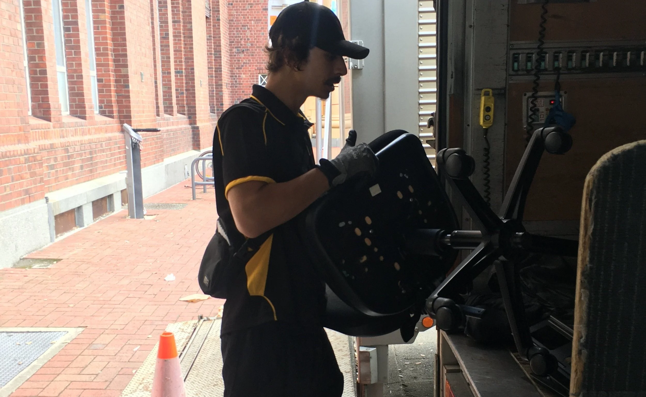 Freear Philip Employee Loading Office Chairs Into Truck