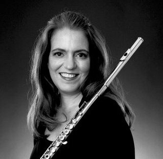 This is Laura Thompson, our flute instructor. Read Laura's impressive bio below, and contact us for flute lessons with Laura Thompson!

Instructor, flute:
Laura is a versatile musician, equally adept on both modern and historical flutes, and is highl