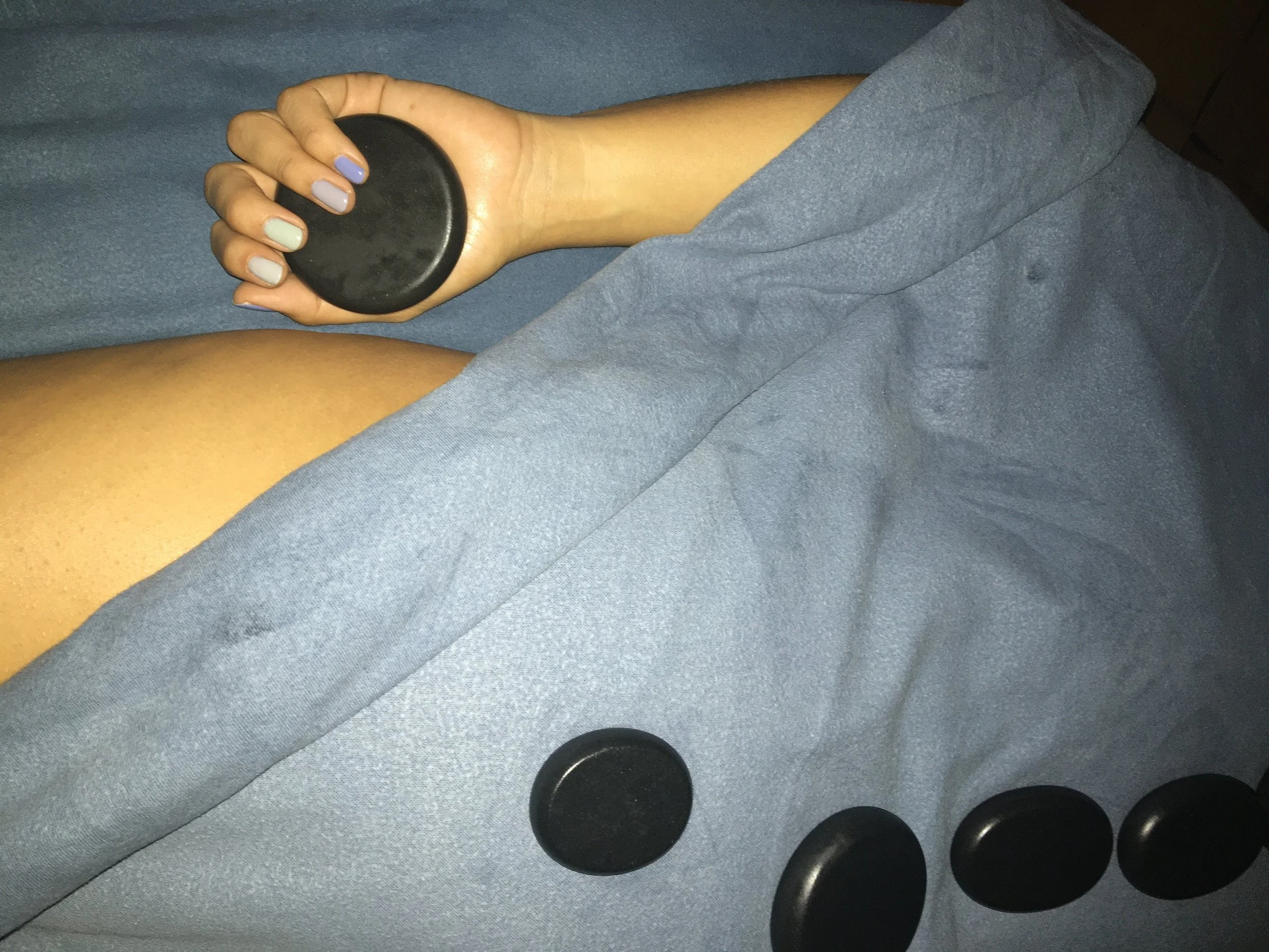 Healing Warmth: The Soulful Benefits of a Hot Stone Massage