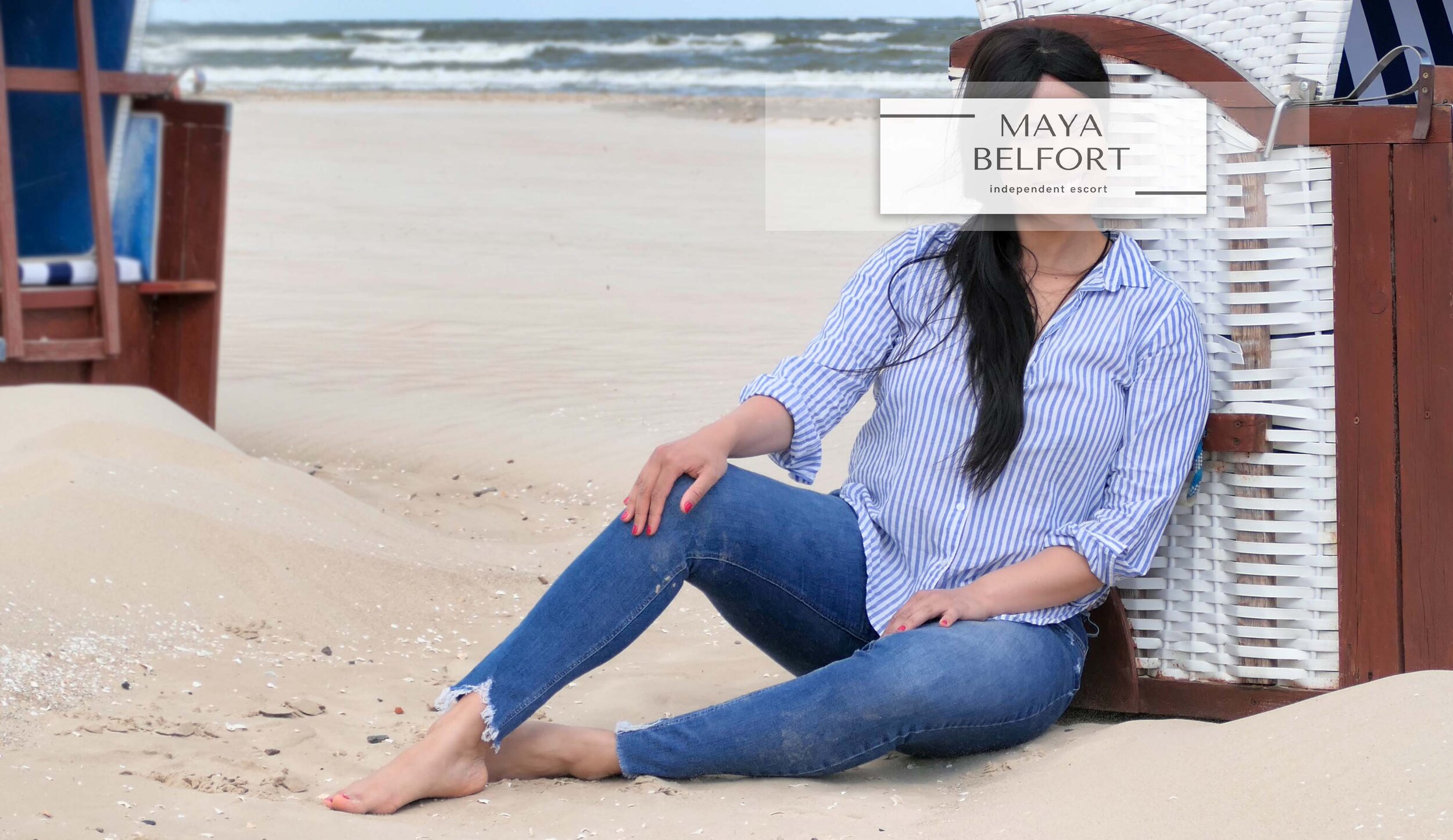 Escort travel companion in Germany and all over the world. In the picture you can see Maya at the seaside at a beach chair.