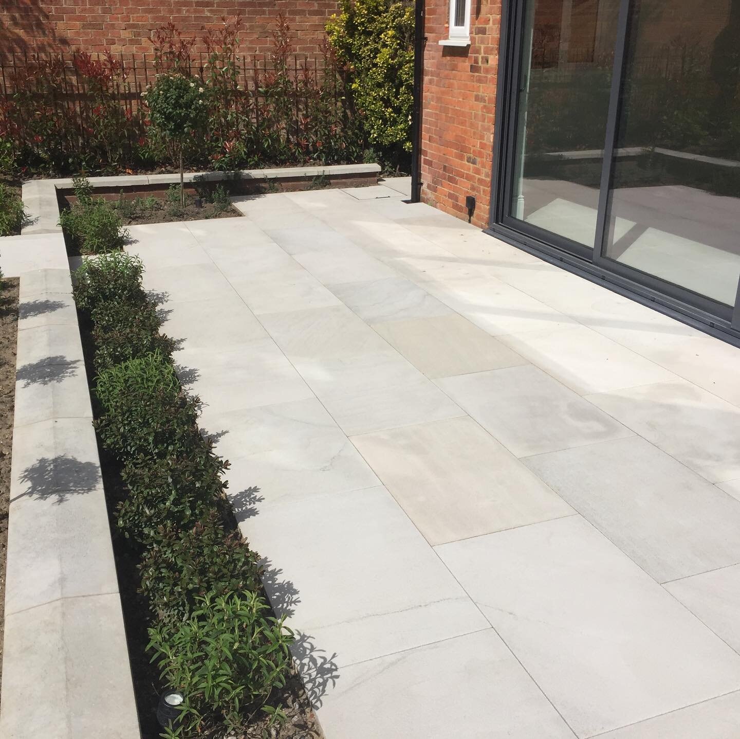 A recently completed project using our 900 x 600mm sawn and shot blasted grey sandstone paving. The product offers a very clean and precise finish to complement a contemporary garden design.  #design  #paving  #gardendesign  #hardlandscaping