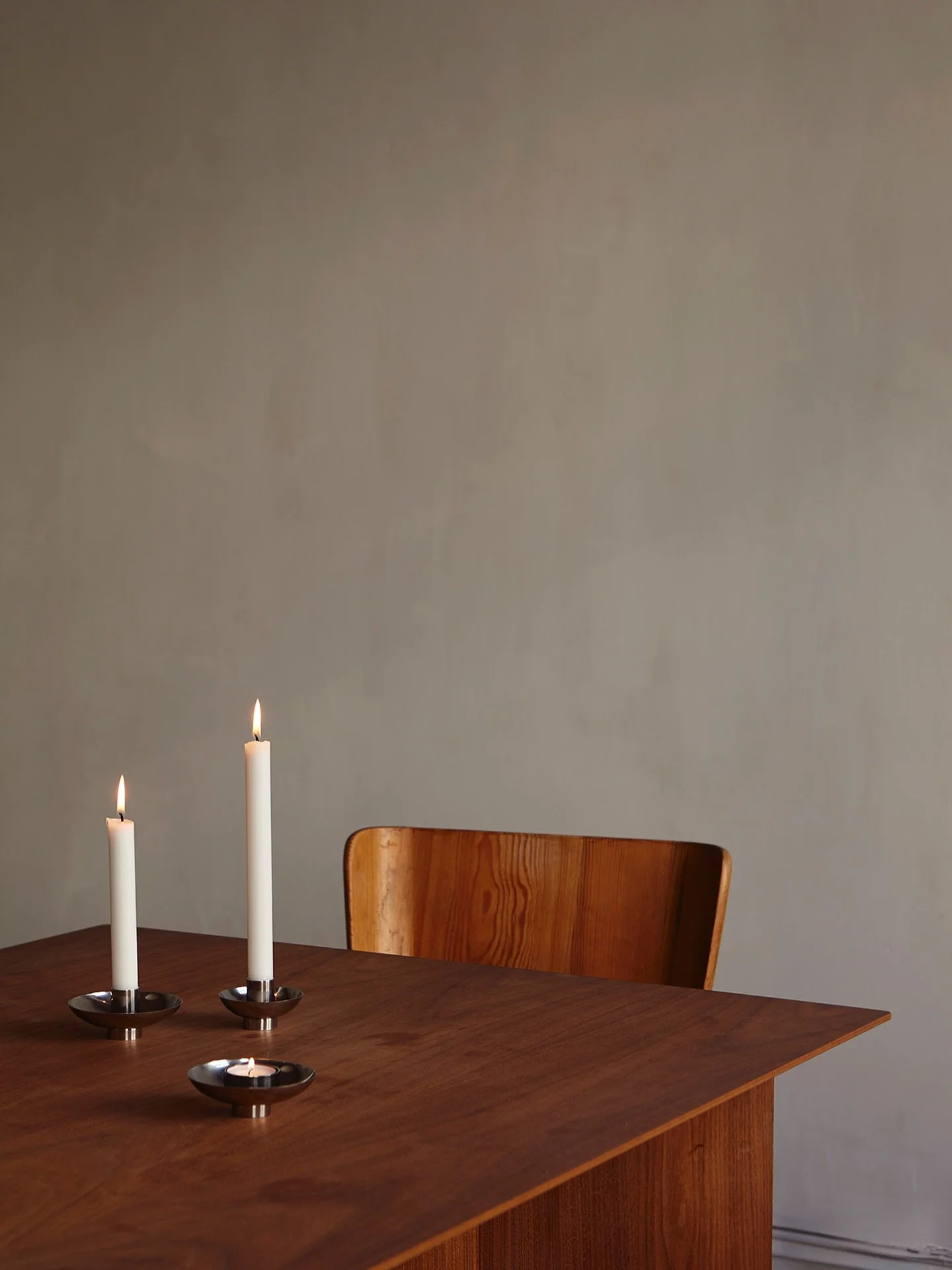 Rotate Candle Collection in stainless steel. The modern finish effortlessly complement any interior, adding a touch of timelessness while allowing the warm glow of candles to take center stage. A collaboration between @ancher_studio and @esseidesign
