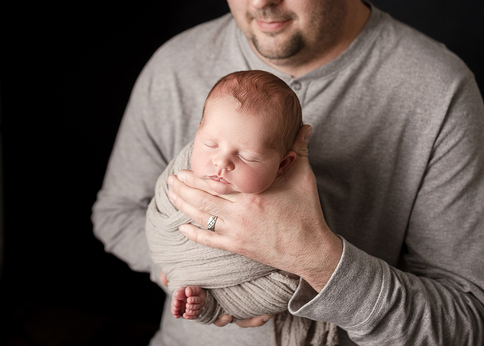 dad holding newborn son, St. Cloud newborn photography
