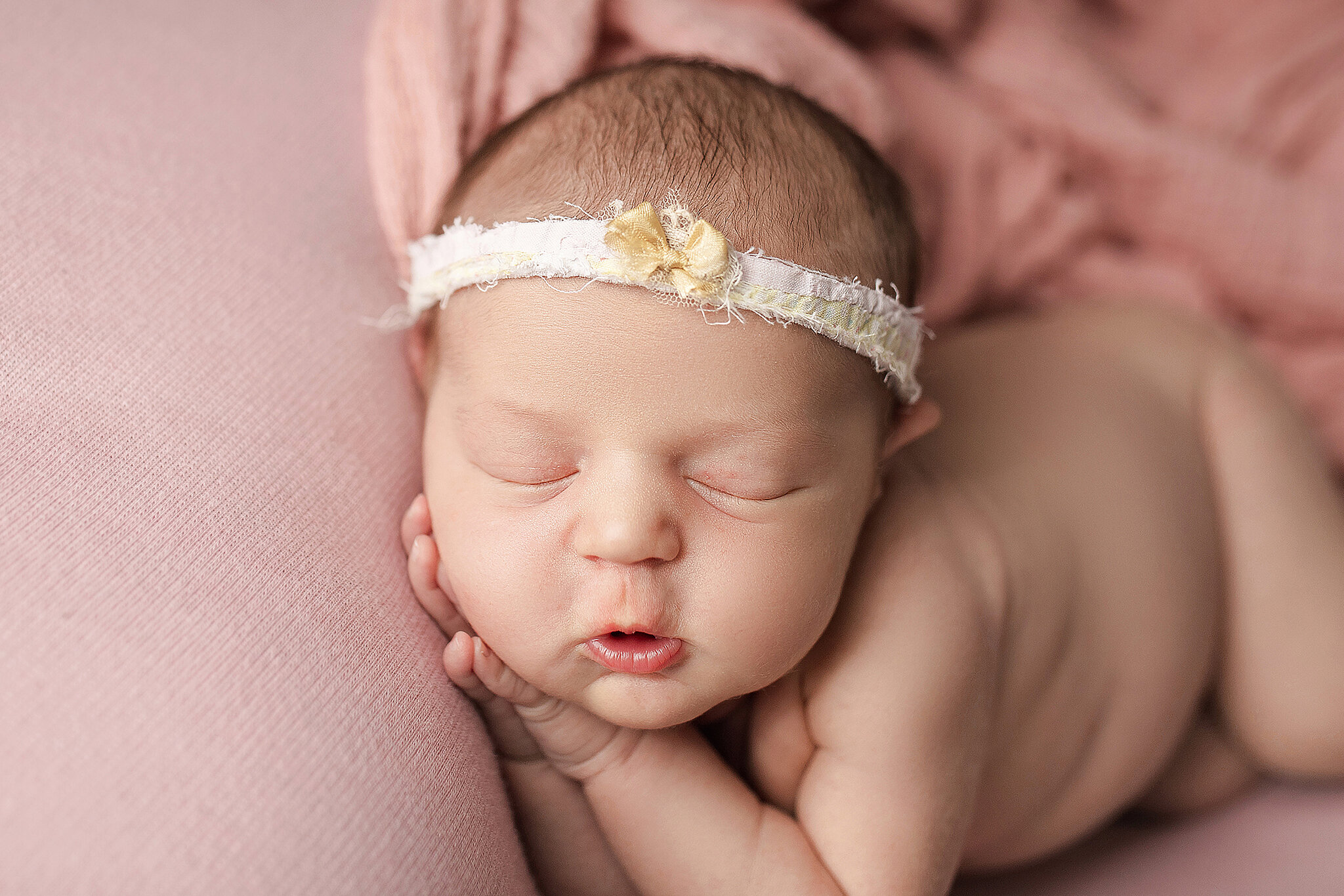 sleeping baby girl wearing headband 