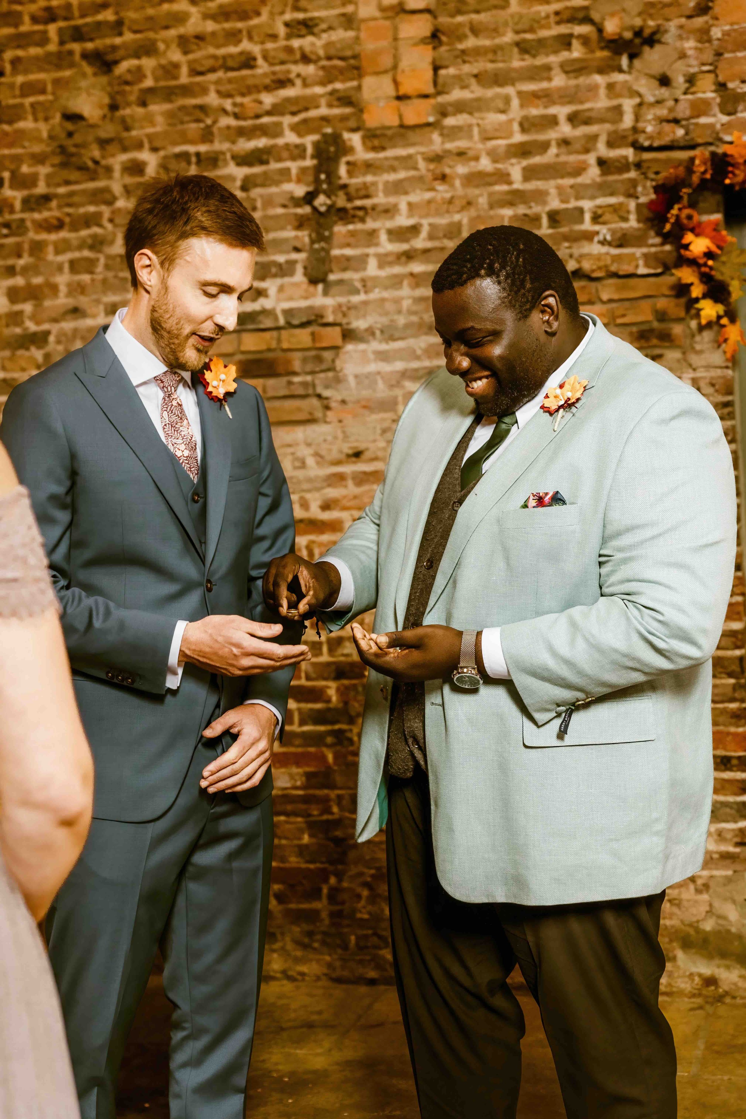 Best man and the rings at wedding ceremony in a barn 