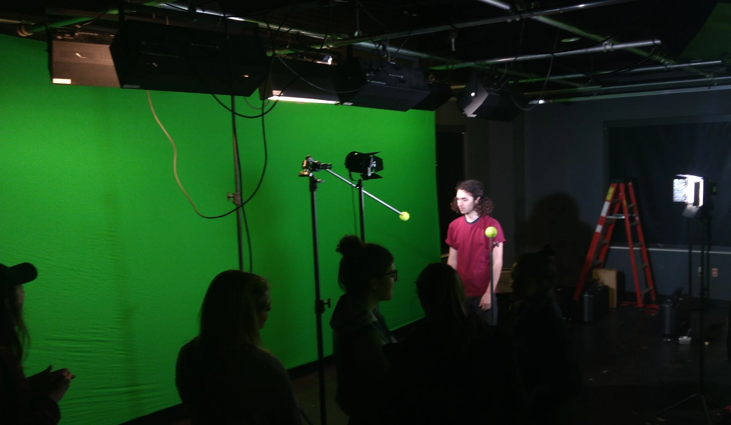 Using an outstretched 10x20 chroma-key green drop cloth in tight studio environments.