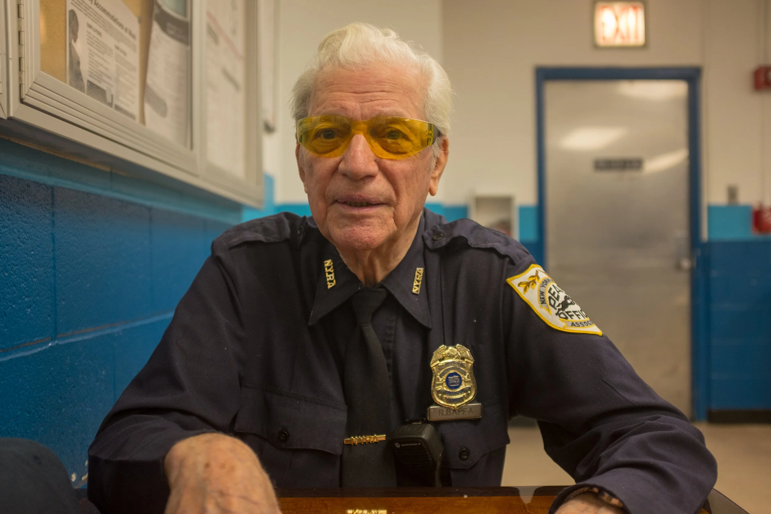 Rudy Baffa, 91, sometimes referred to as "The Singing Cop," has been working at Aqueduct Racetrack for 46 years as a peace officer and says that he likes his job because it allows him to meet people and because it keeps him mentally and physically a…