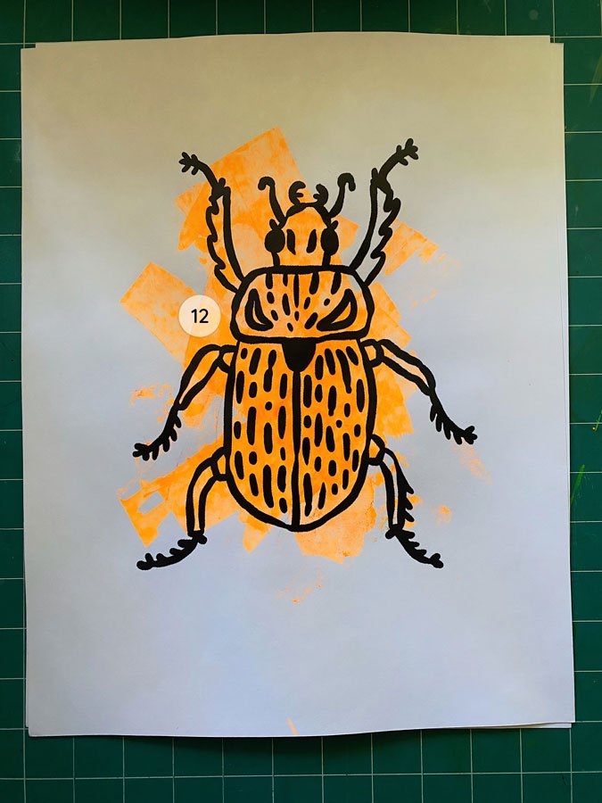 Overview of a hand made 11"x14" screen print of a beetle with a colorful neon orange paint swipe background.