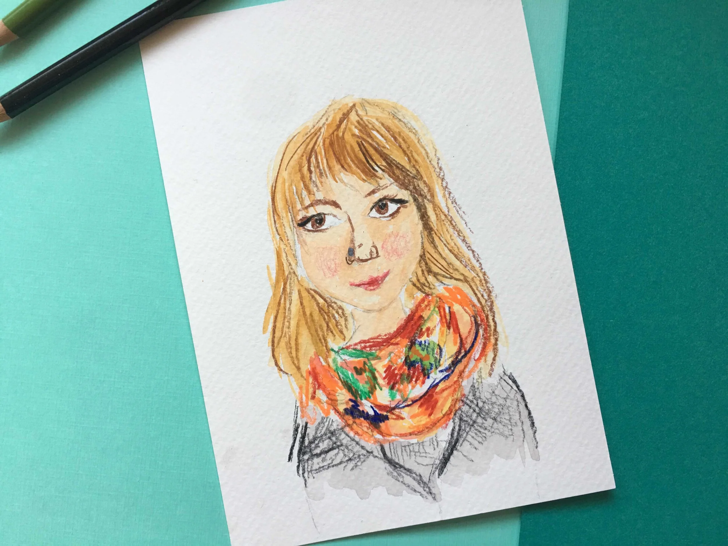 Stylized self portrait using gouache and colored pencils on a teal background surrounded by colored pencils.