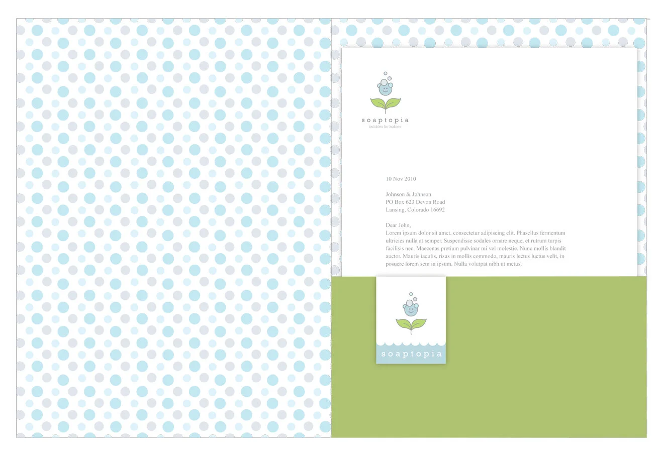 Center of folder: It has a repeating pattern of bubbles, flap is green, and it has stationary and business card stuck in.