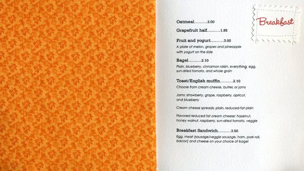First spread: Orange fabric on the left and breakfast choices on the right.