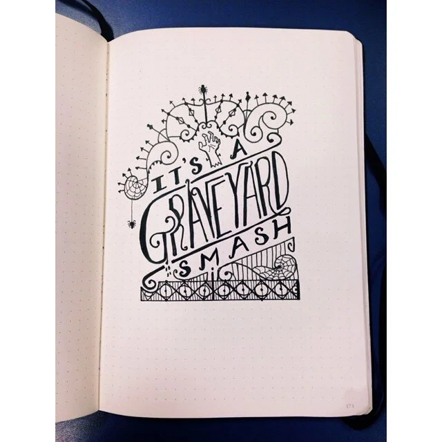 Photo of a typographic illustration of a gothic iron gate that says "It's a graveyard smash" - from Project 365.