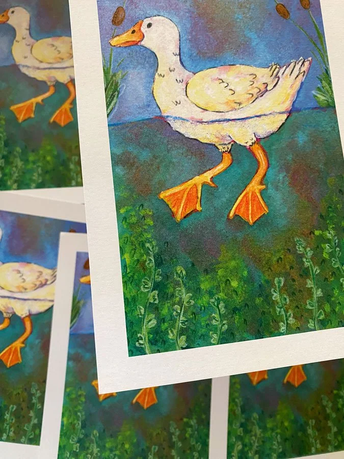 Close up of a duck swimming in a pond with underwater plants. Print measures 5" by 7" and is on recycled stock.