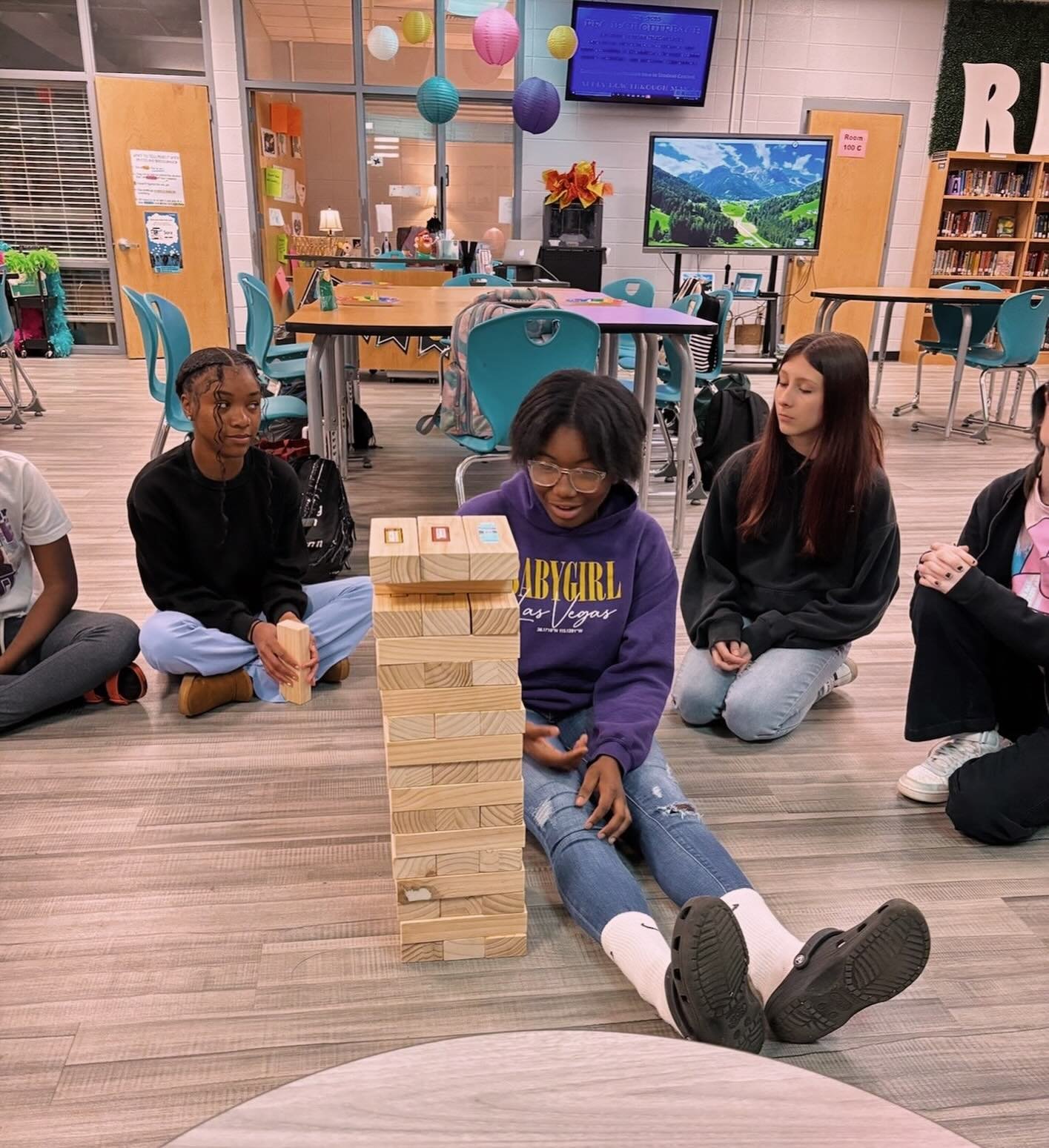 Last week we played Jenga during our school programs. We discussed resilience, and the importance of being able to healthily cope with the adversities that we face. The blocks each contained a question about resilience, and the girls shared about how