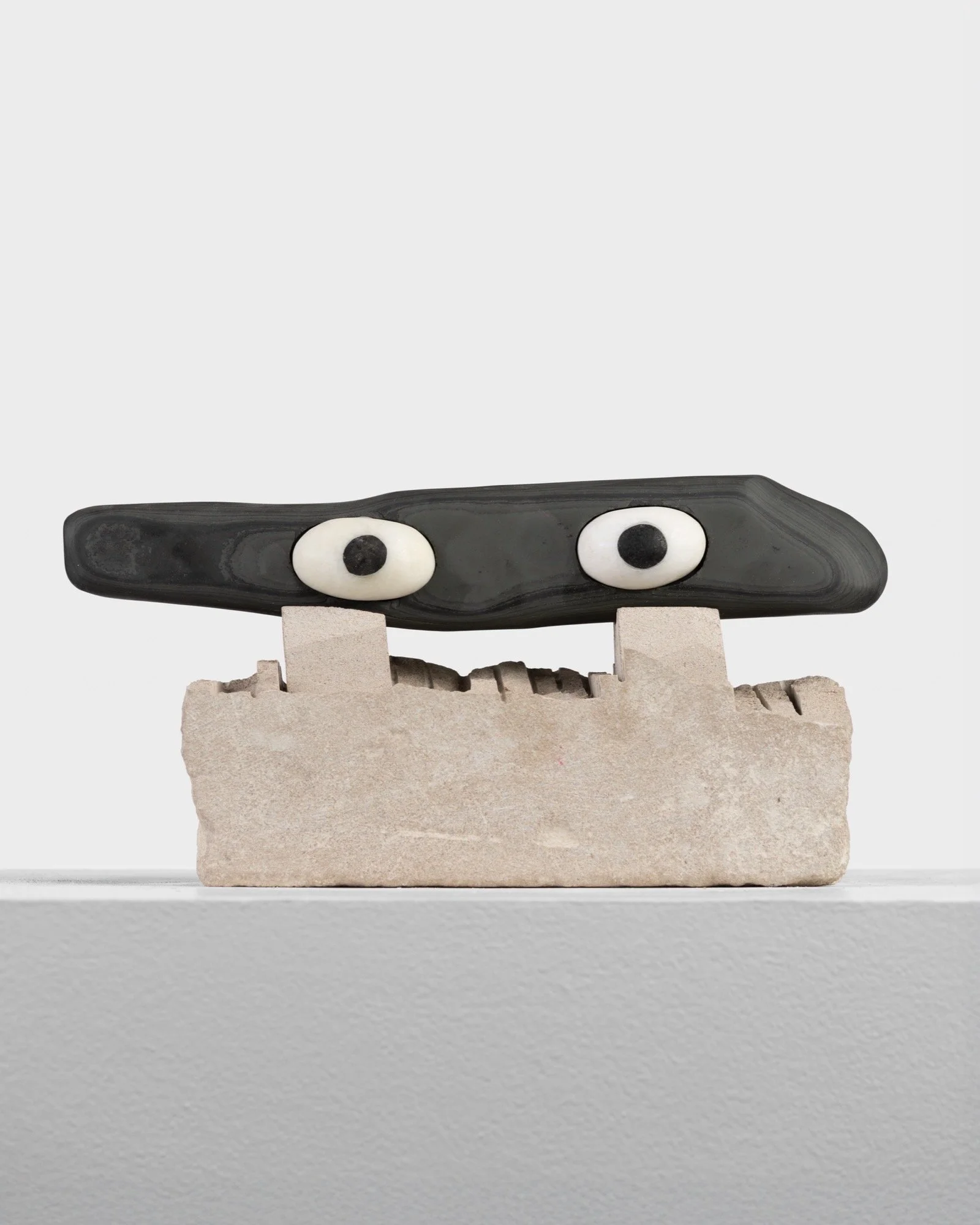 Dan Mandelbaum 
 Zorro's Mask , 2026 
Slate, marble, limestone, and epoxy 
5 x 9 x 3 in (12.7 x 22.9 x 7.6 cm) 
IN11544