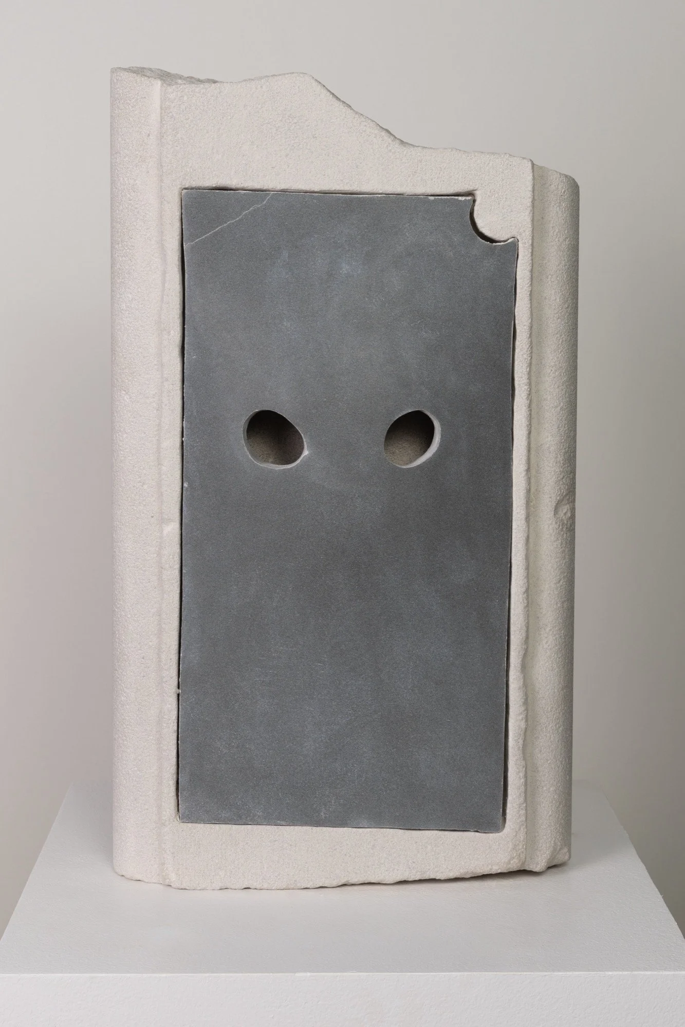 Dan Mandelbaum 
 blank sculpture with eye holes , 2025 
Limestone, black sandstone 
19 x 11 x 4 in