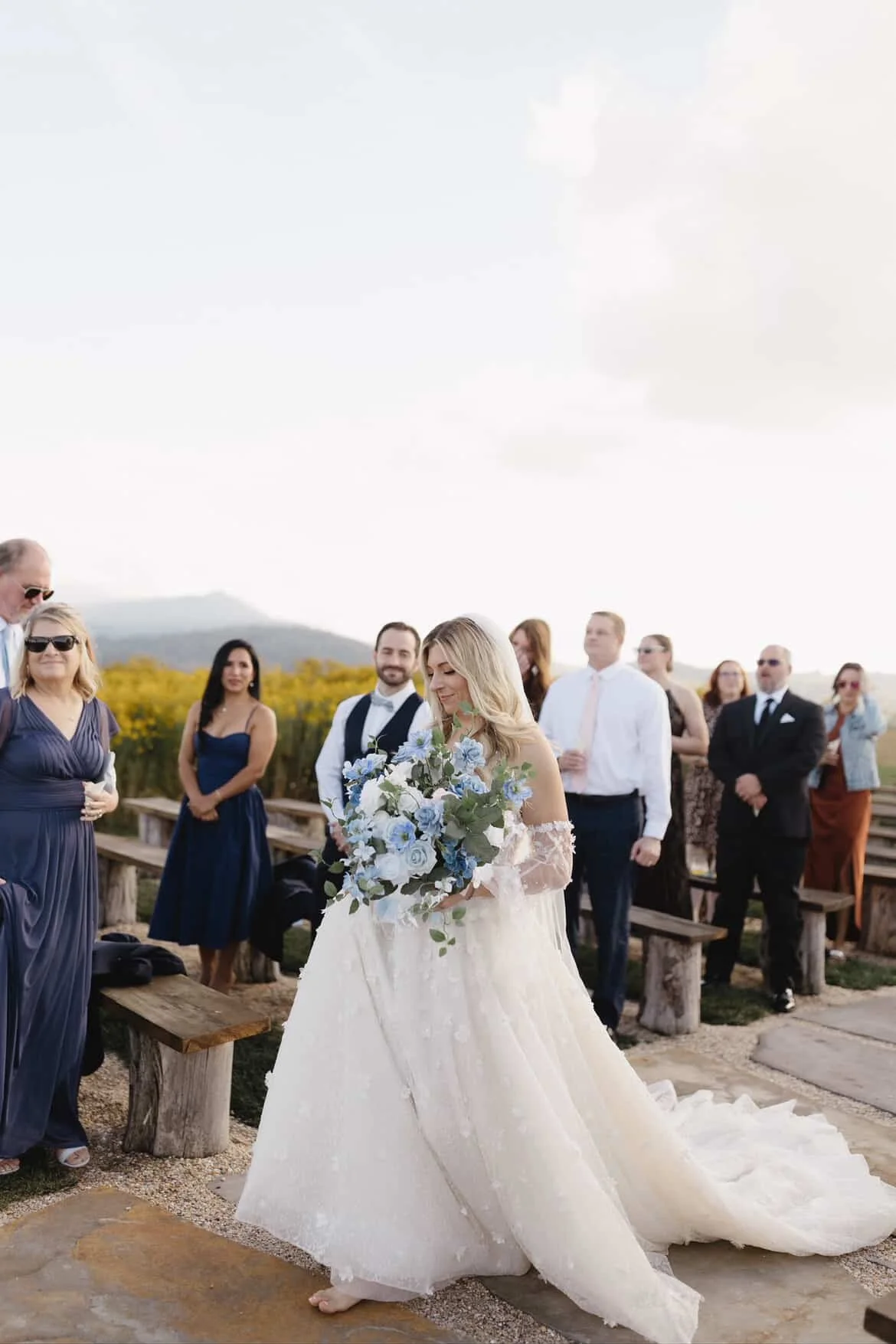 bride walking down the isle with the north carolina mountains in the background