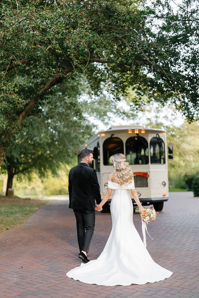 bride and groom send off on a trolly