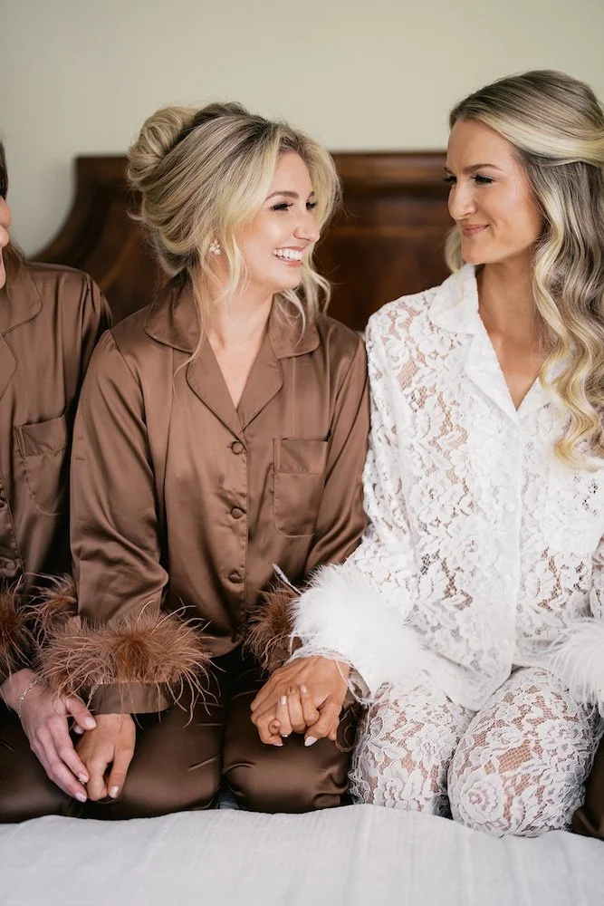 blonde bride and bridesmaid show off their wedding hair styles