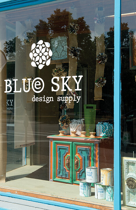  The industrial look of Blue Sky Design Supply is the perfect backdrop for her wares, a unique mix of gift items and home accessories but also practical tools and durable products for individuals, building professionals and organizations. 