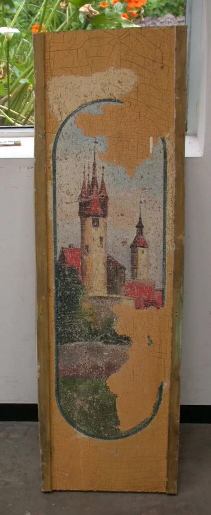 Removing old yellow paint to reveal the castle