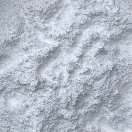 A close up of a pile of GEKCO loose chalk, it is a bright white fine powder