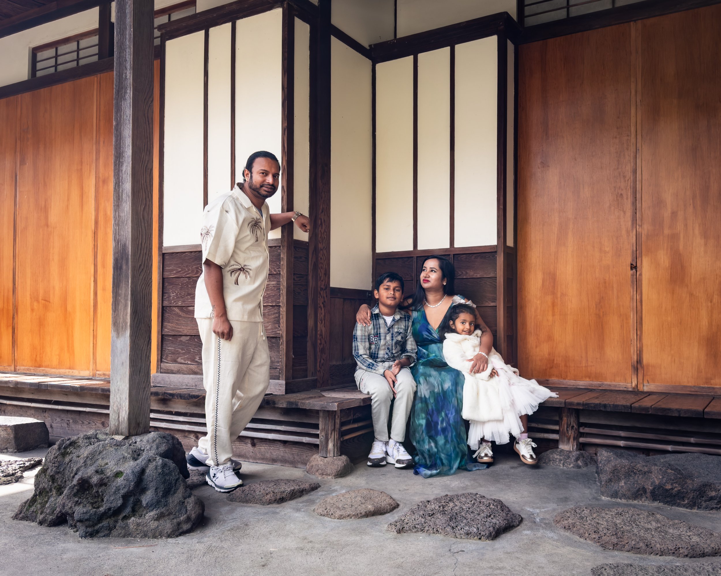 Family resting together at San Mateo Japanese Garden
