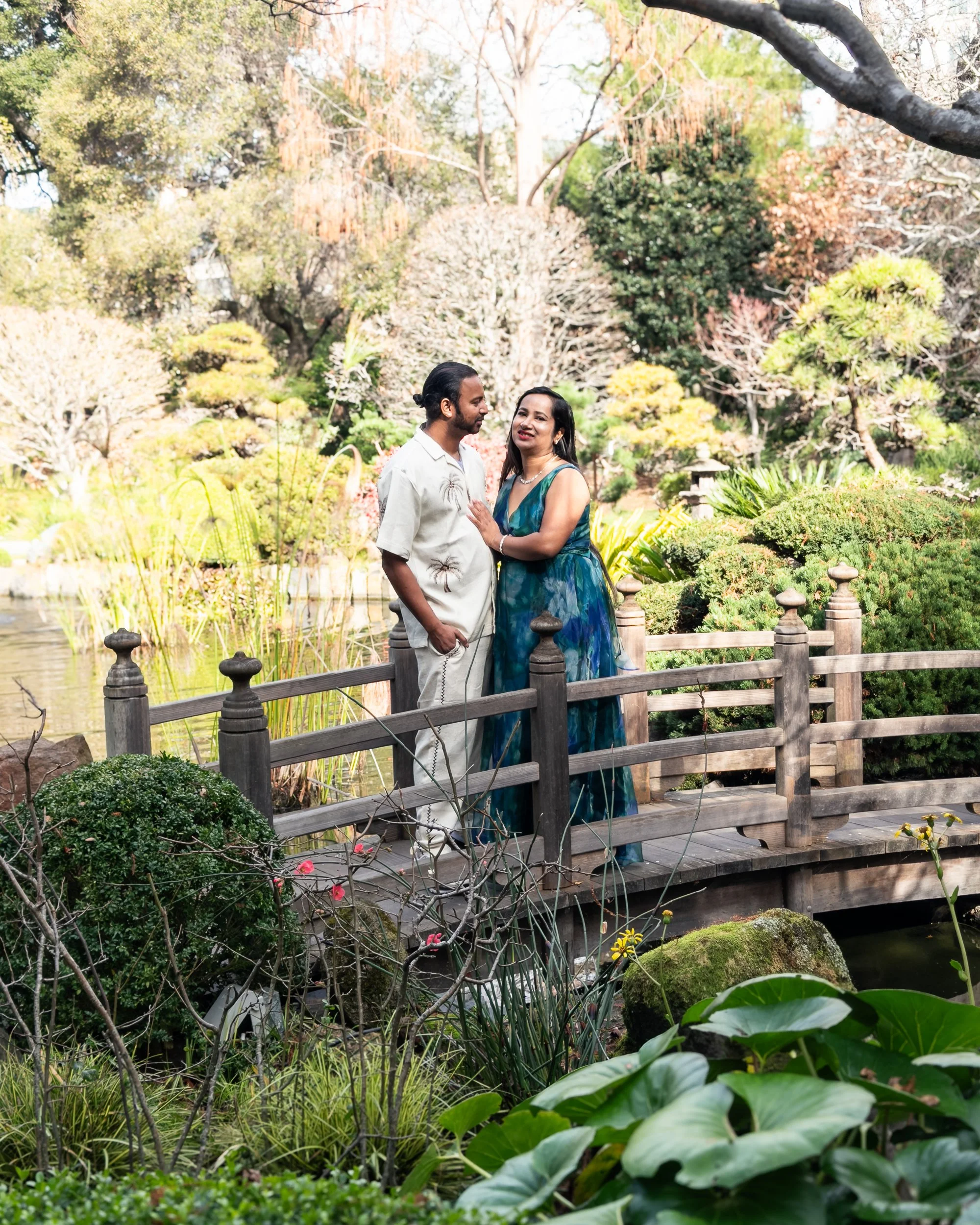 Parents sharing a moment on the bridge
