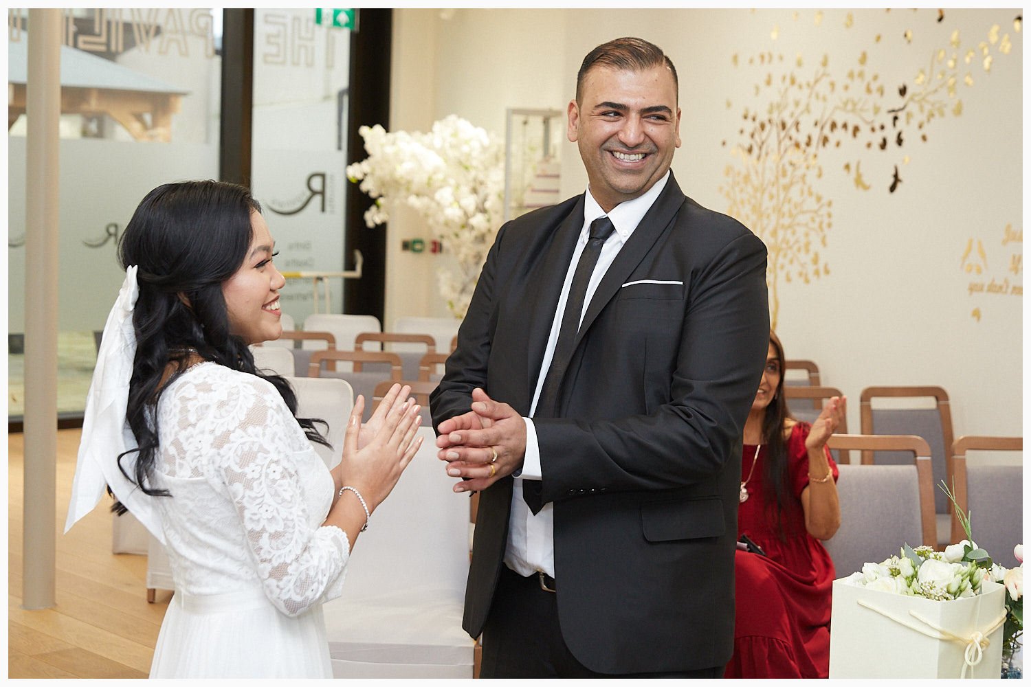 Bride and groom during their wedding ceremony at Harrow Registry Office