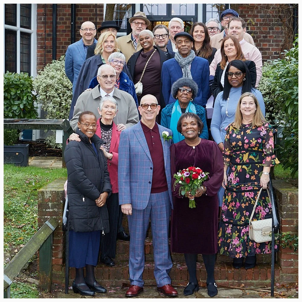 Group photo of all the guests with the bride and groom after the wedding at Weybridge Registry Office