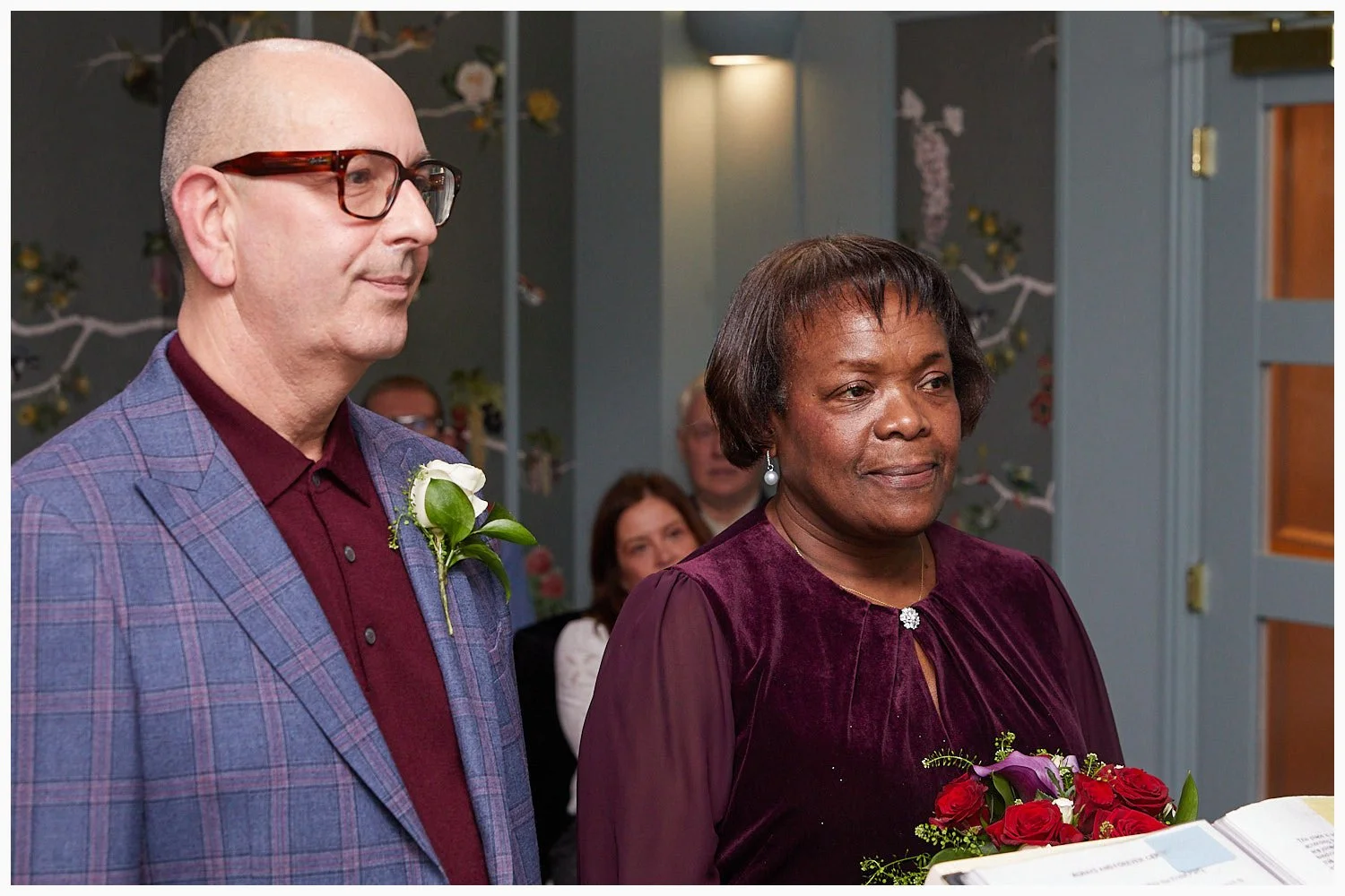 Bride and groom get down to the serious matter of making their wedding vows at Weybridge Registry Office