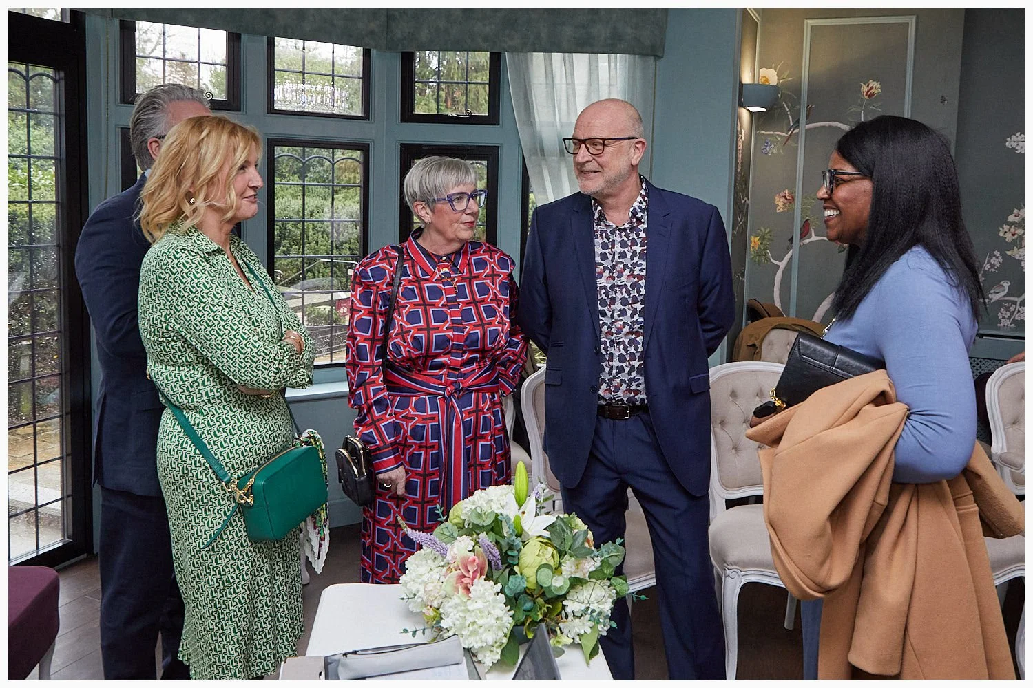 Guests arrive ready for the wedding ceremony in the Oatlands Room at Weybridge Registry Office