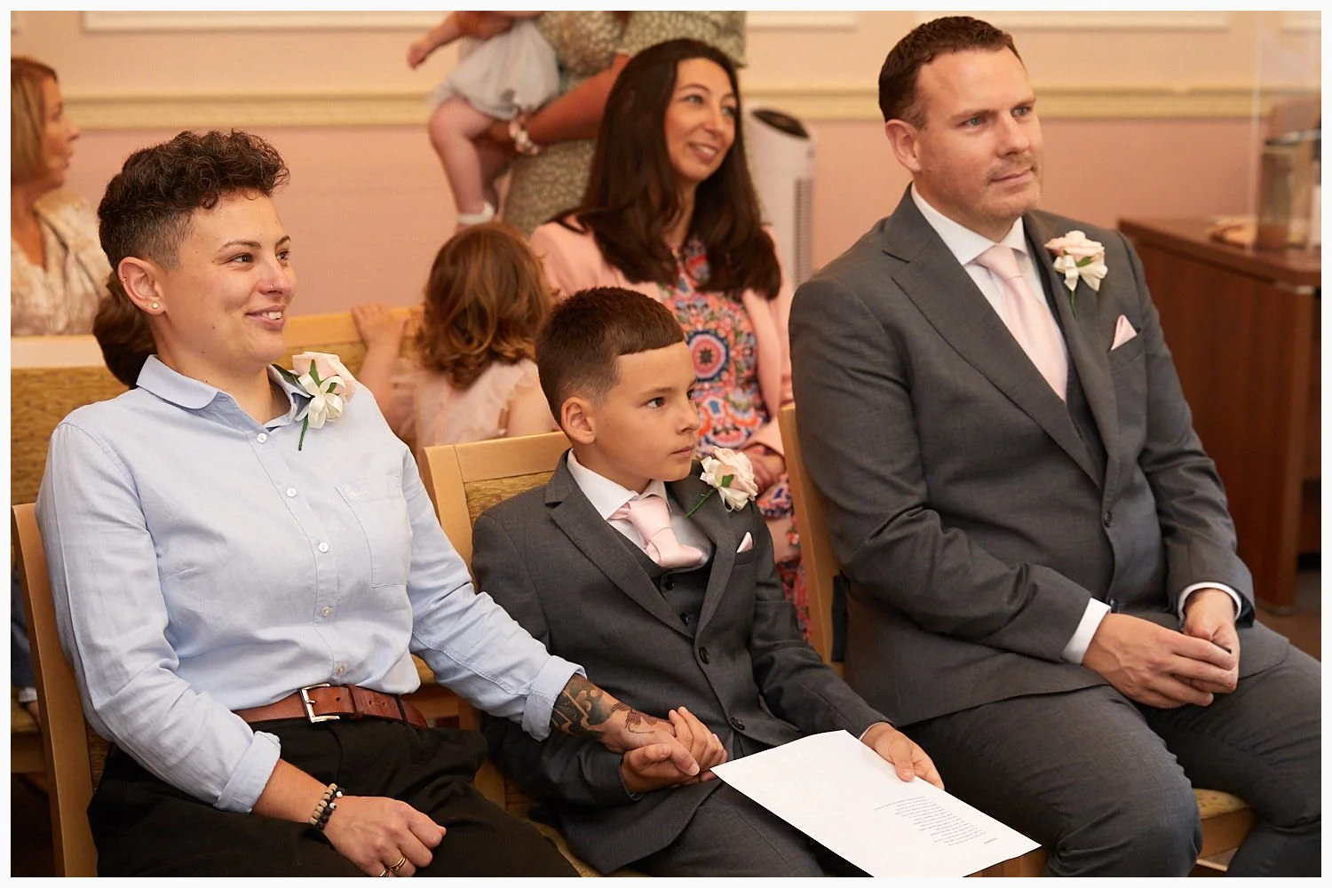 Guests enjoy the wedding ceremony in progress in the Carnarvon Room