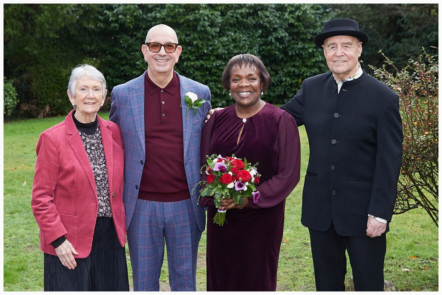 Bride and groom with the grooms parents at Weybridge Registry Office