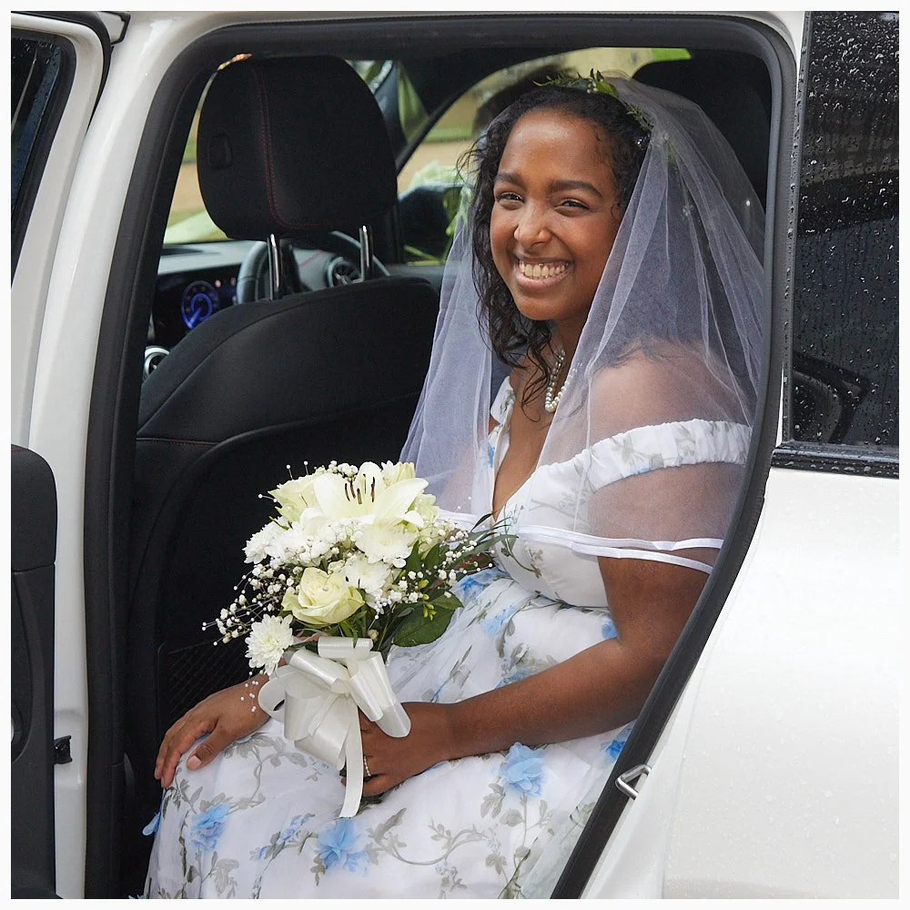 Bride arrives by car for her wedding at Goldings, Basingstoke Registry Office