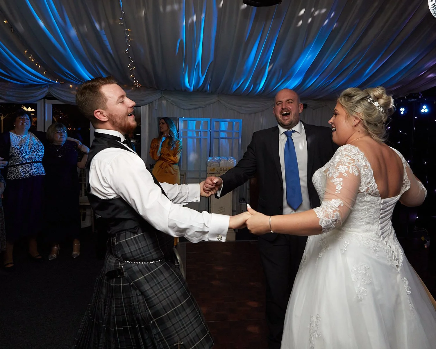 Bride and groom and their guests enjoy amazing dancing  during their evening at The Mill House Hotel Swallowfield
