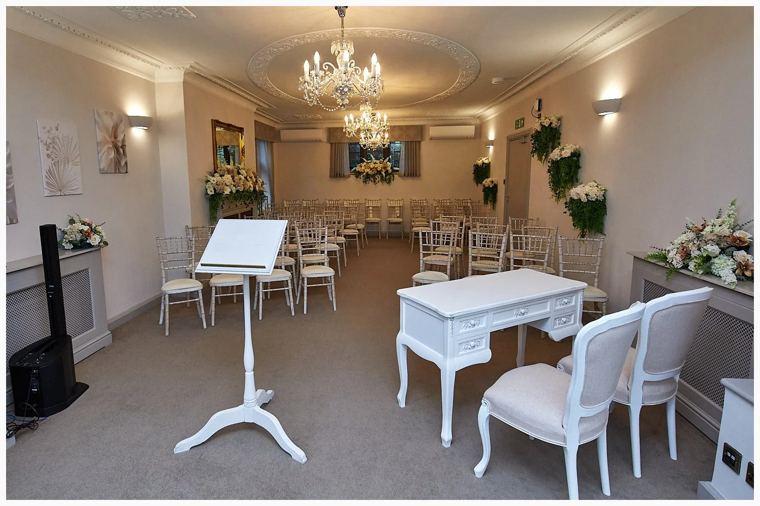 The Buckingham Room, the larger of the two wedding ceremony rooms as seen from the front of the room at Weybridge Registry Office
