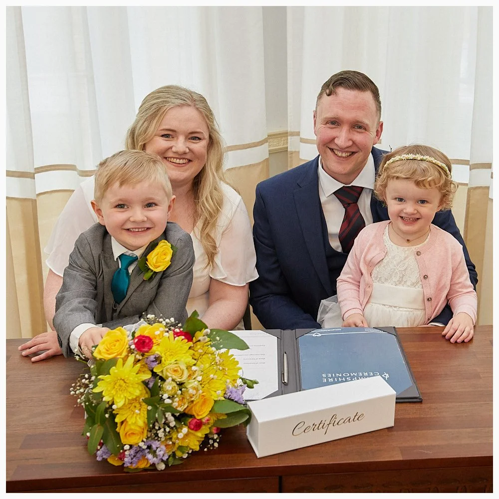 Bride and groom with their lovely kids during the signing of the Marriage Schedule at Goldings, the Basingstoke Registry Office