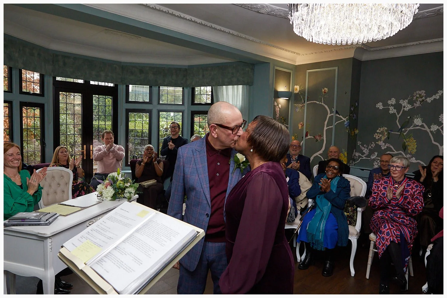 Bride and groom have their first kiss at the wedding ceremony at Weybridge Registry Office