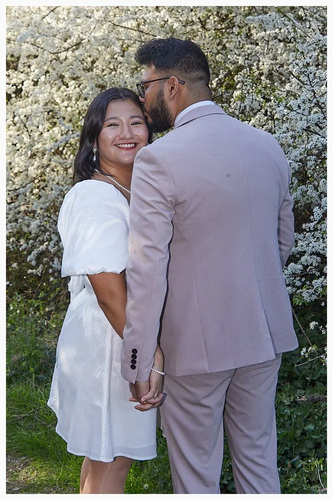 Bride and groom enjoy a lovely Spring day in a local park after their wedding ceremony at Slough Registry Office