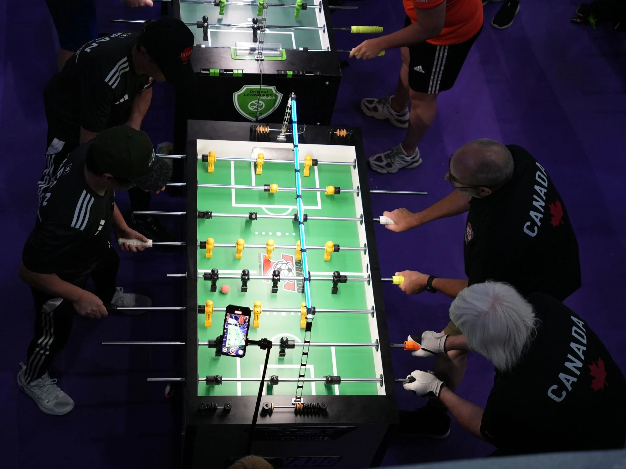 Tim Dudra (top right) and Gerry Meister (bottom right) face Japan substitute players in Qualification Round 3.