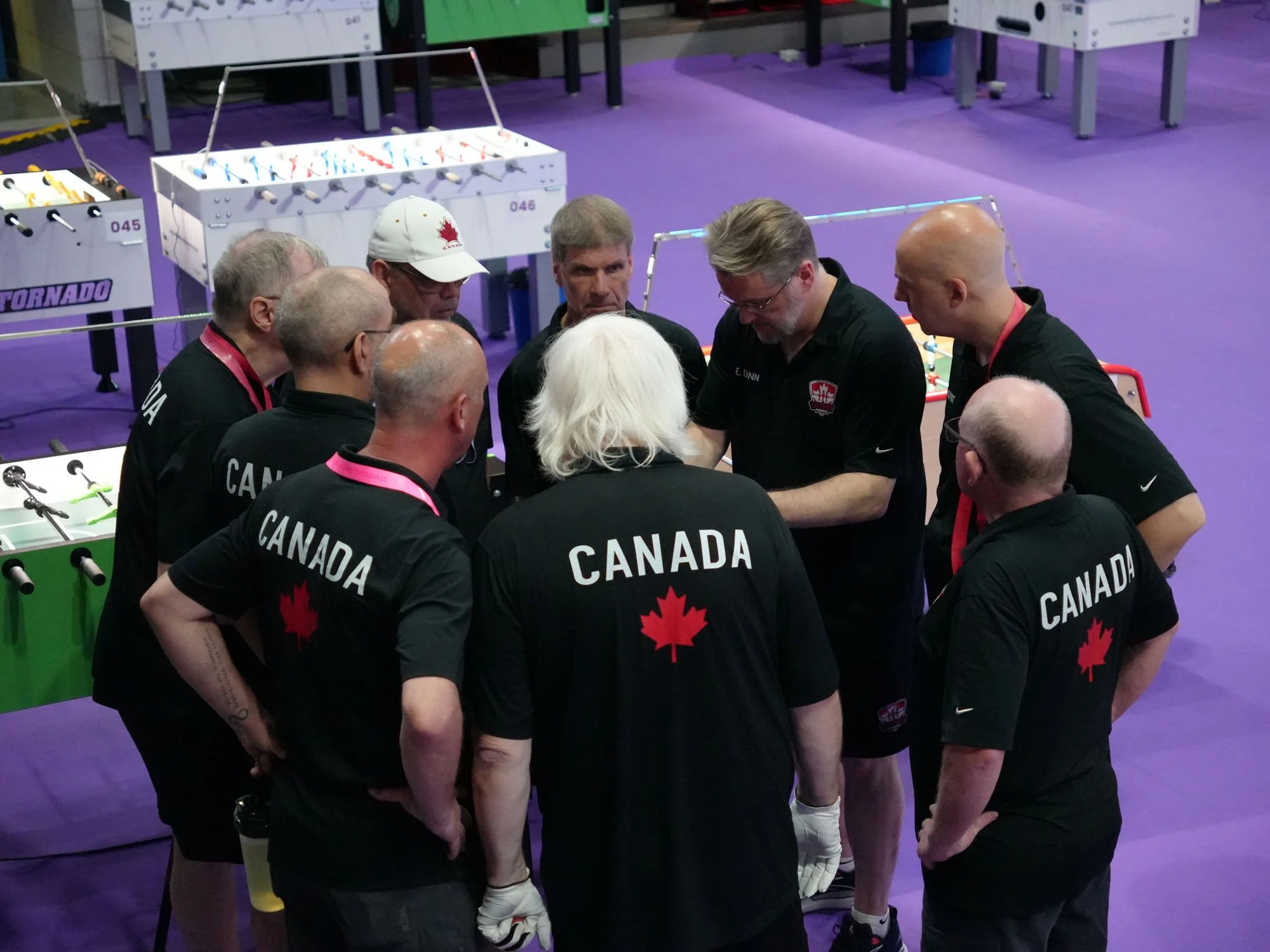 Captain Eric Dunn briefs Canada’s Seniors before the USA semi‑final.
