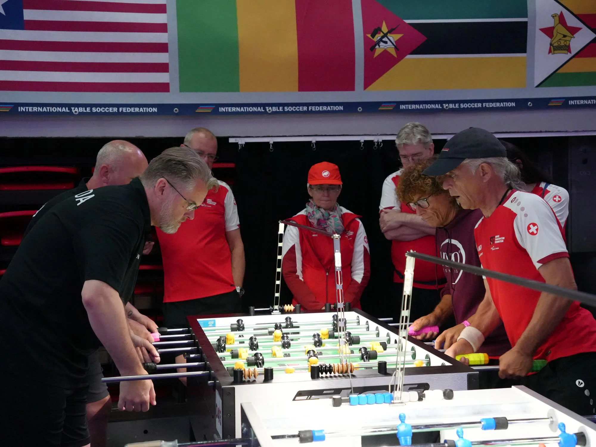 Eric Dunn (forward) and Peter Tielens play Christian Pomponi (forward) and Egon Kuonen in Canada’s Last‑16 win over Switzerland.