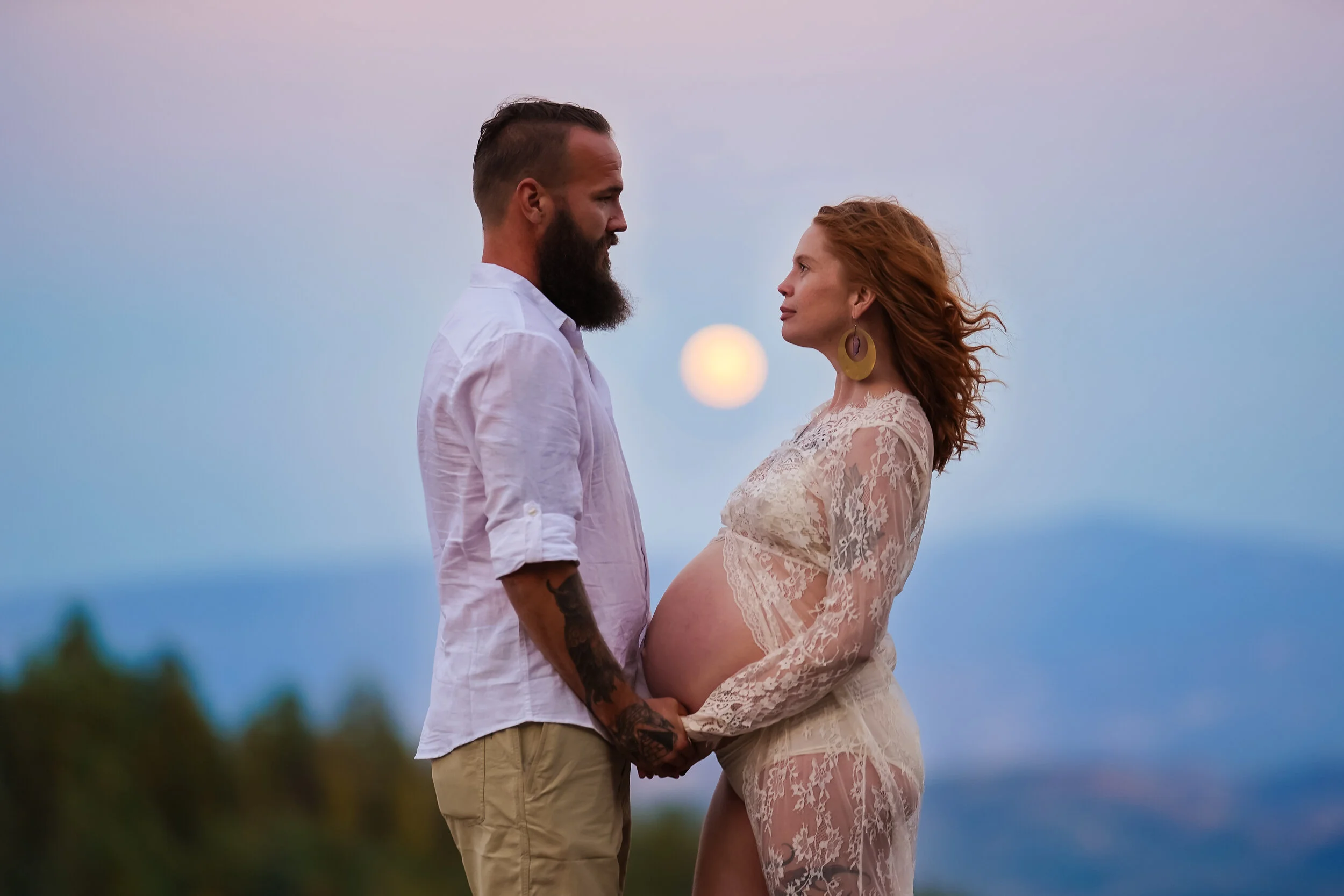 Maternity of parents-to-be as the moon rises in their hearts. 