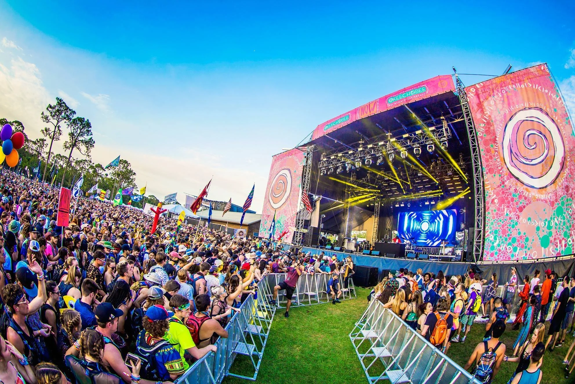 Okeechobee Live Nation Insomniac Florida music festival concert graphic designer branding brand design illustration logo merch stage wristbands mainstage design scrims