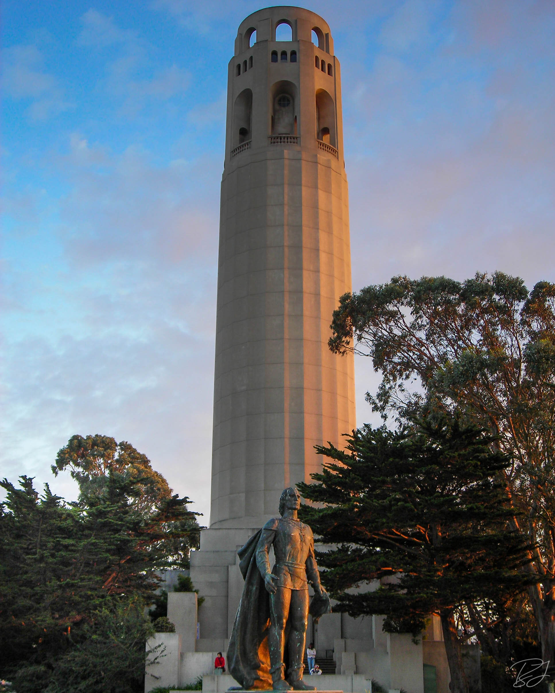 Coit Tower with the 12-foot bronze Columbus statue, sculpted by Count Vittorio di Colbertaldo of Verona, Italy. Originally erected in 1957, it was removed in 2020. San Francisco, California.